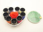 Close-up of 12 sewing needles included in the kit.