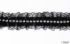 Full length view of 5 metres of black lace ribbon trim.