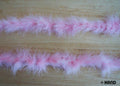 Baby pink feather garland displayed on a white background.