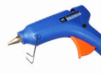 Glue gun with various glue sticks ready for use