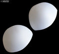 Two pairs of white comfortable bra pads displayed on a flat surface.