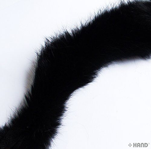 Close-up of black rabbit fur sew in pipe trim on a white background.