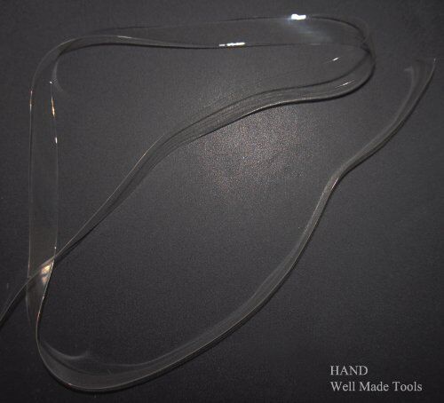 Clear flat crystal shoulder strap displayed with sewing tools