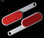 Close-up of the dual-action button on the lint brush