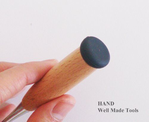 Various materials including card and cloth with the awl.
