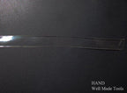 Roll of clear flat crystal shoulder strap showing length