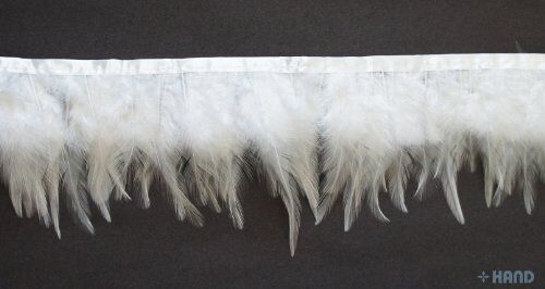 Close-up of natural white duck feathers stitched onto trim.