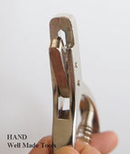 Close-up of the 11 cm pattern notcher punch handle