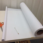 Measuring the width of the pattern cutting tracing paper.