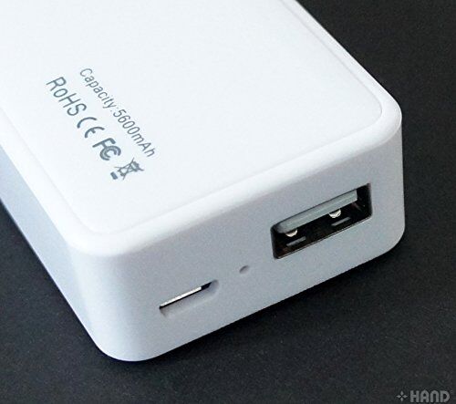 Power bank in hand, showcasing its compact size
