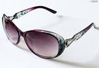 Display of sunglasses in various colours on a neutral background.