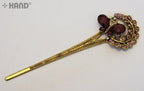 Stylish hair pin with sparkling rhinestones, perfect for any occasion.