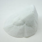 Close-up of white reglan shoulder pads showing texture.
