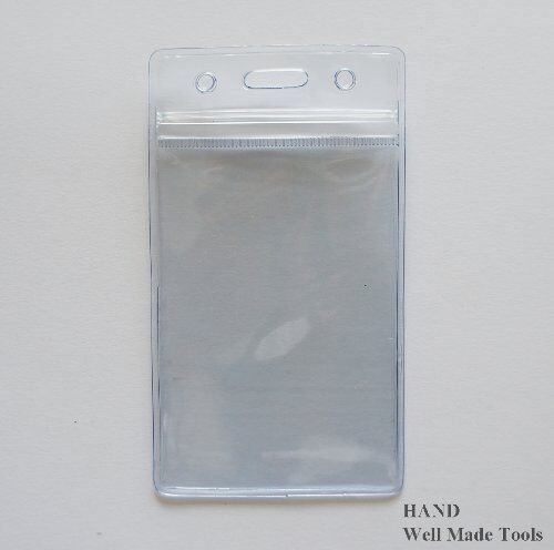 Pack of 50 clear ID badge holders on a table