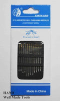 Three self threading needles of varying sizes displayed on a white background.