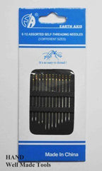 Three self threading needles of varying sizes displayed on a white background.