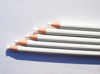 User holding a white wax china marker pencil for marking.