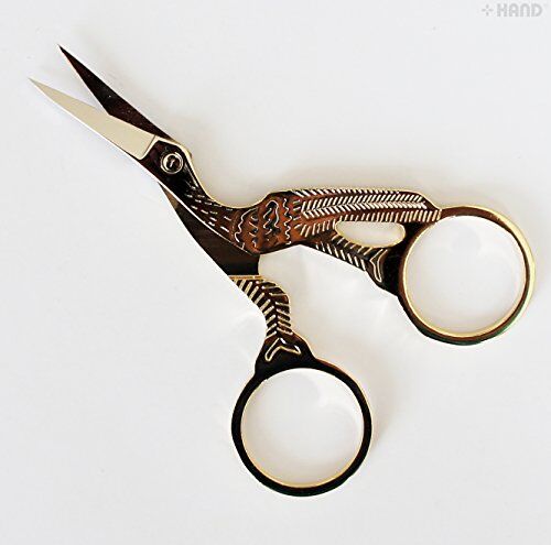 Classic forged stork embroidery scissors with gold plated finish.