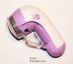 Lint remover in use, effectively removing fuzz from fabric