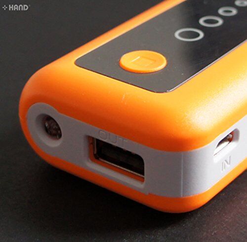 Battery charger with flashlight illuminated in dark