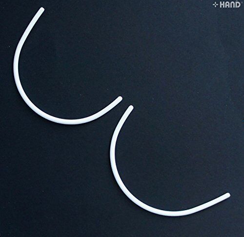Different angles of plastic bra under wires for crafting.