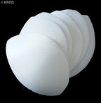 Assorted sizes of white bra pads laid out for selection.