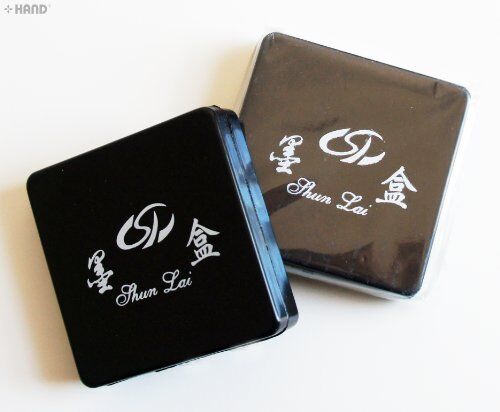 No.2 square ink box with lid open, revealing storage space.