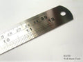 Solid steel ruler marked with metric measurements, 300mm long.