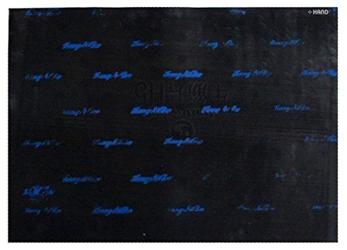 Black and blue flexible cutting mat on a desk