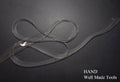 Clear flat crystal shoulder strap on a white background.