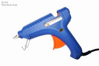 Fast hot large glue gun on a workbench with craft supplies