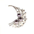 Elegant ladies' brooch featuring a flower blossom design with diamante crystals.