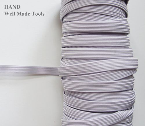 Spool of icy white extra strength max stretch flat elastic cord, 8mm wide.