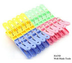 Close-up of a colourful plastic clothes peg showcasing its strong spring.