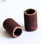 User demonstrating the drum sanding bands on a project