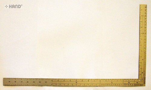 Ruler being used for measuring fabric in a sewing project