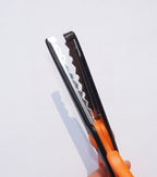 Close-up of stainless steel blades on the edger scissors.