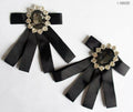Elegant vintage brooch with ribbon and clear crystals