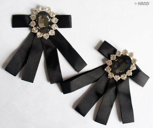 Elegant vintage brooch with ribbon and clear crystals