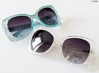 Retro sunglasses displayed with UV400 protection label.