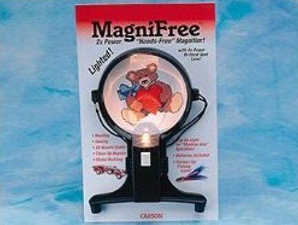 User wearing the MagniFree magnifier while working on a craft project.