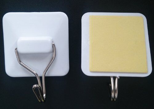 Self-adhesive hook in use in a bathroom setting