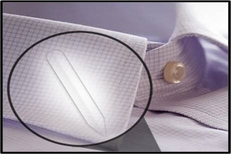 Collar stays in use, keeping a shirt collar crisp and neat.