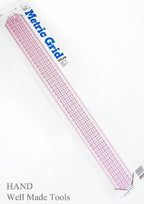 Ruler being used to measure fabric accurately.