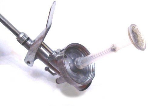 Close-up of the oil injection gun showcasing its nozzle and design.