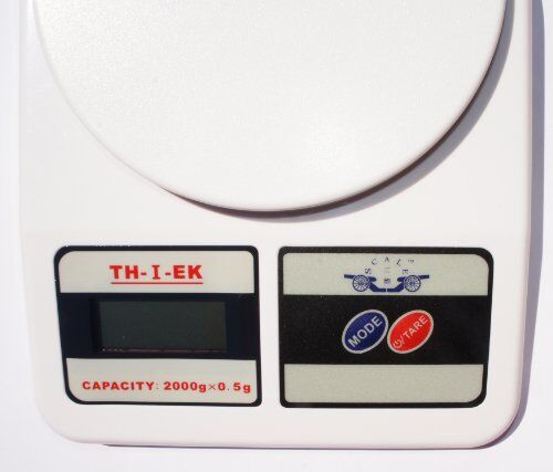 Close-up of the postal scale's durable plastic body.