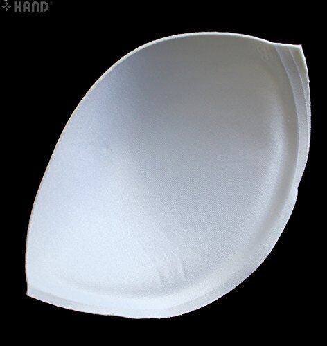 Close-up of assorted sizes of bra cup pads in white