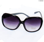 Two pairs of ladies' sunglasses with dark tinted lenses