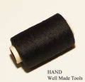 Twelve spools of black polyester sewing thread arranged neatly.