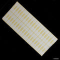 Sheet of white jewellery pricing tag labels with dumbell bag seals